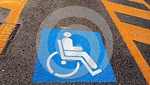 Wheelchair Handicap Sign on dark asphalt road street background- handicap parking place