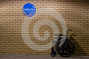 Wheelchair with No Smoking Sign