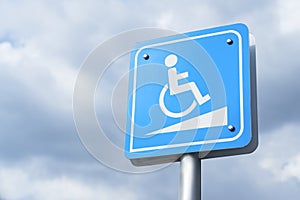 Wheelchair ramp sign against blue sky, copyspace.
