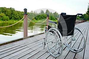 Wheelchair on the river bank