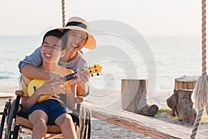 Wheelchair on the sea beach go to travel on holiday concept.