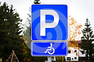 Wheelchair symbol in a Parking Lot marks disabled parking space.