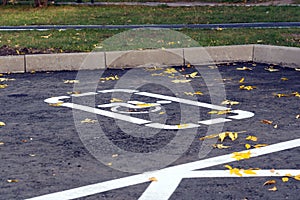 Wheelchair symbol on the parking spot for disabled people