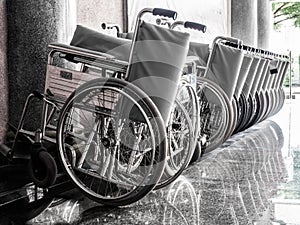 Wheelchairs parked together.