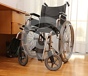 Wheelchairs to disabled people in a bedroom