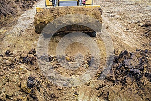 Wheeled loader excavator with backhoe for earthmoving works