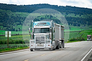 18 wheeler semi truck delivering cargo on the road photo