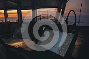 Wheelhouse in modern ship with ECDIS and Bridge Log book