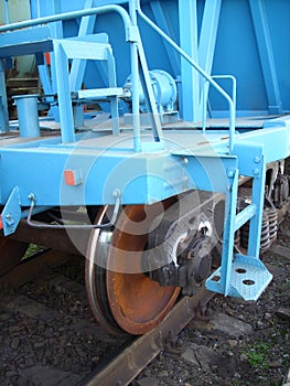Wheels on freight rails at a railway station