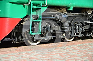 The wheels of a modern Russian electric train with shock absorbers and braking devices. The side of the ca