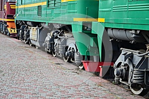 The wheels of a modern Russian electric train with shock absorbers and braking devices. The side of the ca