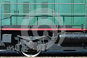 The wheels of a modern Russian electric train with shock absorbers and braking devices. The side of the ca