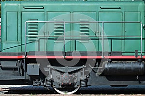 The wheels of a modern Russian electric train with shock absorbers and braking devices. The side of the ca