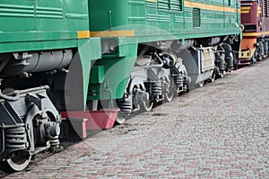 The wheels of a modern Russian electric train with shock absorbers and braking devices. The side of the ca