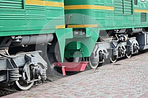 The wheels of a modern Russian electric train with shock absorbers and braking devices. The side of the ca