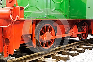 Wheels of an old locomotive on the rails