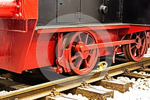 Wheels of old locomotive on the rails