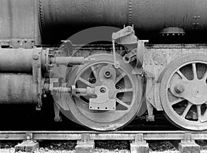 wheels on an old rusting abandoned steam locomotive with missing