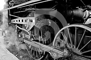 Wheels of an old steam locomotive photo