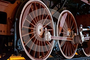Wheels of an old steam locomotive close-up