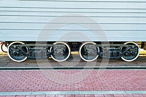 Wheels of a train a carriage, wheels with a white rim.