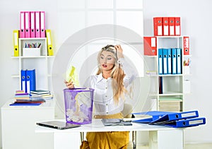 where is it. ceo in messy office. throw garbage into paper container. woman hold full paper bin with crumpled papers