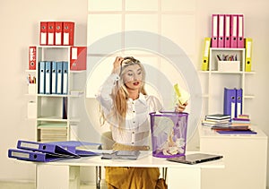 where is it. ceo in messy office. throw garbage into paper container. woman hold full paper bin with crumpled papers