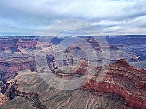 Where Earth meets Sky, and Dreams embrace Clouds: The Enigmatic Symphony of the Cloudy Grand Canyon