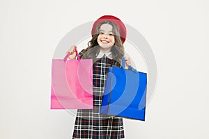Where fashion comes to life. Shopping day. Happy child hold packages. Girl with shopping bag. Save money. Rediscover