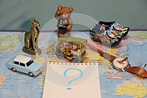 Where are we going on vacation? The symbols of the countrys on the map. Old Blue car, Thai keb, a bear from Berlin. I love Berlin.