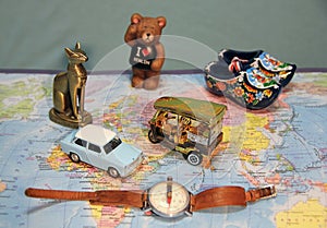 Where are we going on vacation? The symbols of the countrys on the map. Old Blue car, Thai keb, a bear from Berlin. I love Berlin.