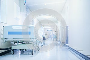 Where healing happens. Shot of a hospital bed in an empty corridor of a modern hospital.