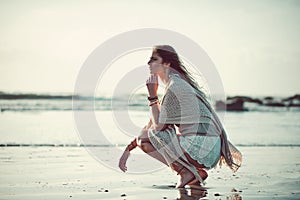 This is where I belong. an attractive young woman spending a day at the beach.