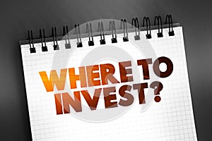 Where To Invest Question text on notepad, concept background