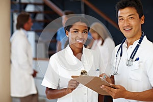 Where your health is our success. Portrait of two smiling medical professionals.