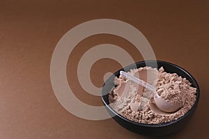 Whey chocolate protein scoop. Sports nutrition. Sports nutrition for building muscles, vitamins for making cocktails