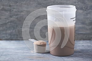 Whey protein shaker and scoop. Sport nutrition.