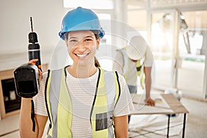 Which room should I start in. an attractive young construction worker standing inside and holding a power drill.