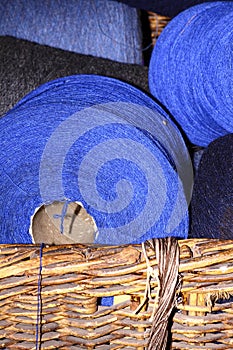 Whicker basket full of cotton bobbins