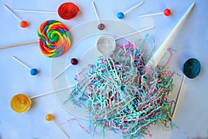 Cotton candy Lollipops on clouds background with paper lolly pops