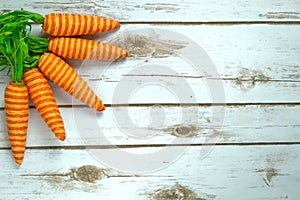 Whimsical Orange Carrots on a whitewashed wood rustic background