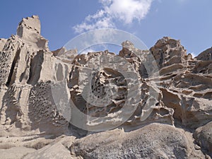 Whimsical relief, formed by weathering and erosion. Santorini, Greece.