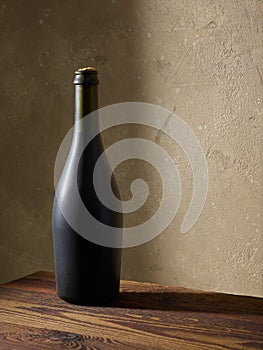 Whine bottle on wooden table