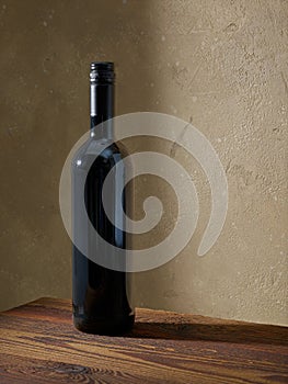 Whine bottle on wooden table