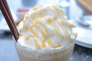 Whip cream and caramel of ice coffee.