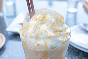 Whip cream and caramel of ice coffee.