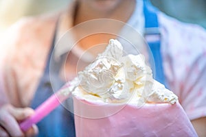 whipped cream cooking process.woman mixing Fresh cream for making whipped cream or desserts and bekery.woman making whipped cream