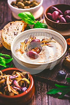 Whipped feta cheese dip with garlic, olives, lemon and caramelized onions