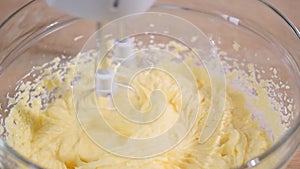 Whipping butter cream in a bowl.