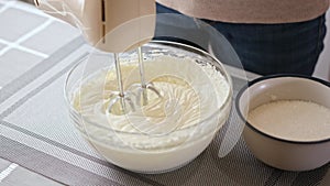 Whipping cream cheese in a glass bowl